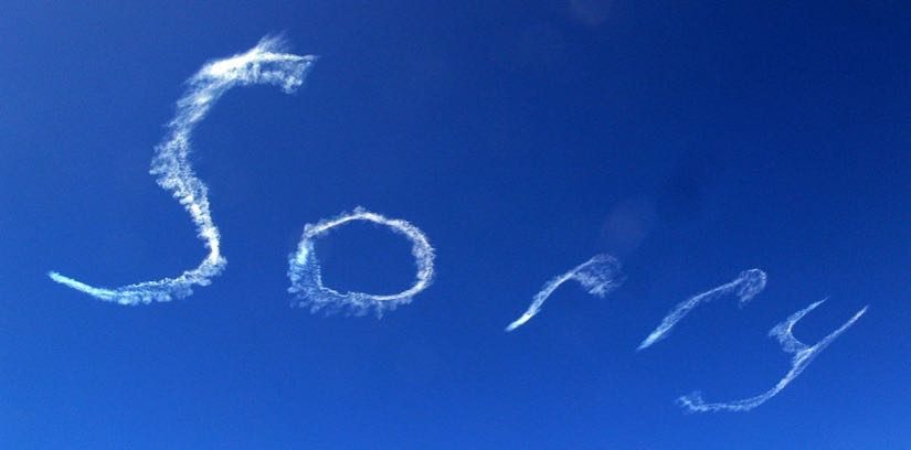A picture of the word 'sorry' written in the sky.
